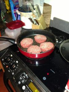 Just some raw meat hanging out in a pan. 